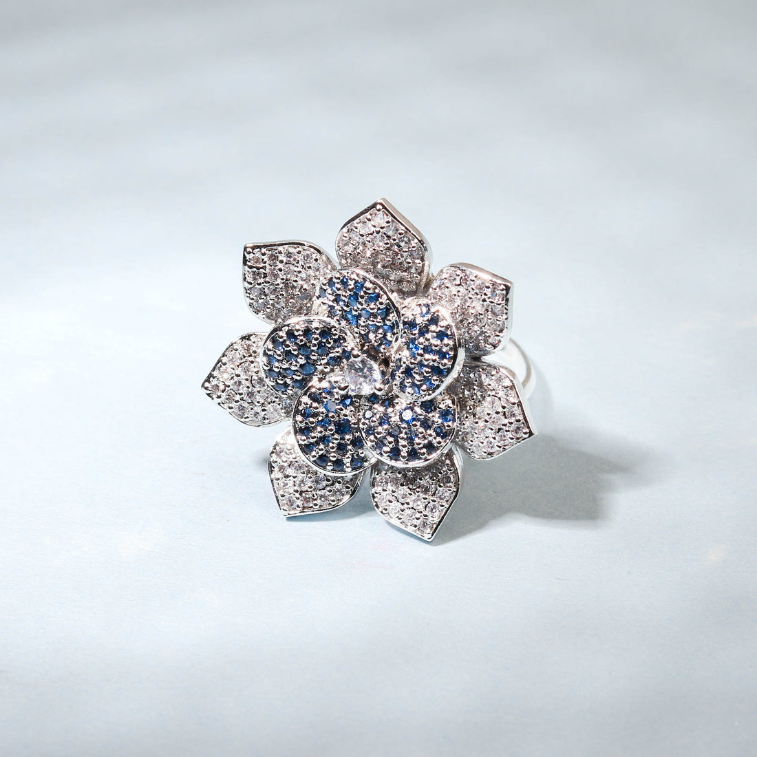 Elegant Flower Shaped Finger Ring With Blue Stones For Women - Free Size