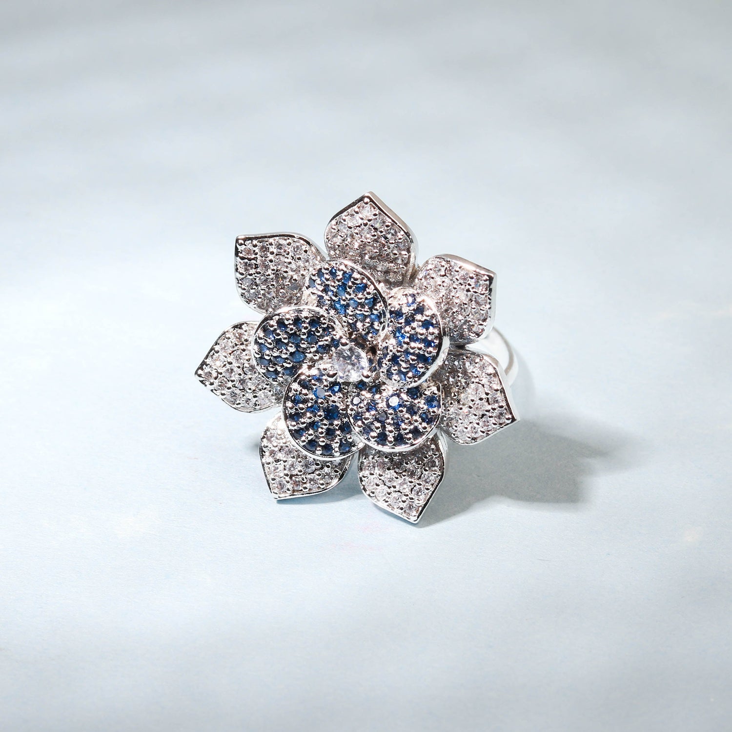 Elegant Flower Shaped Finger Ring With Blue Stones For Women - Free Size