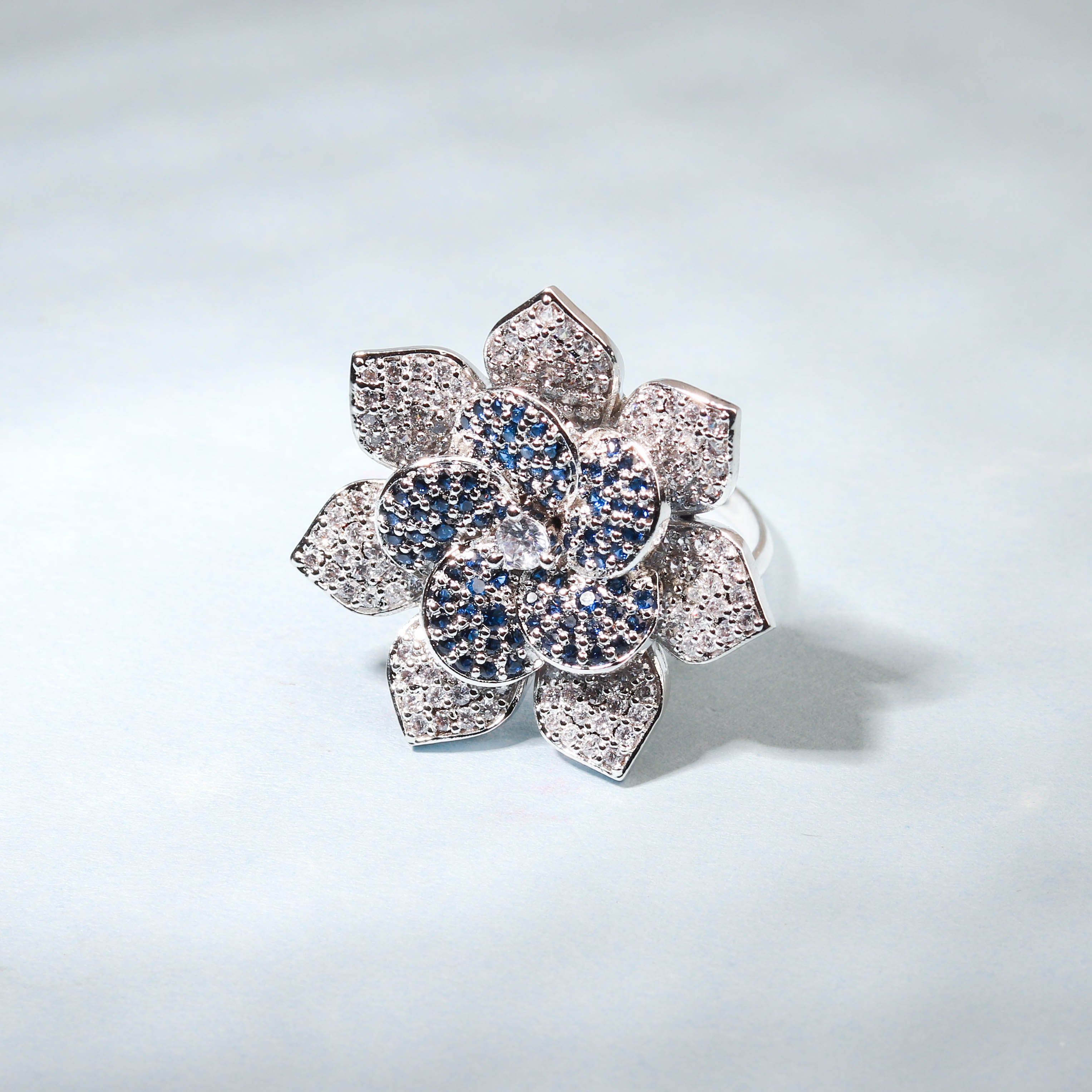 Elegant Flower Shaped Finger Ring With Blue Stones For Women - Free Size