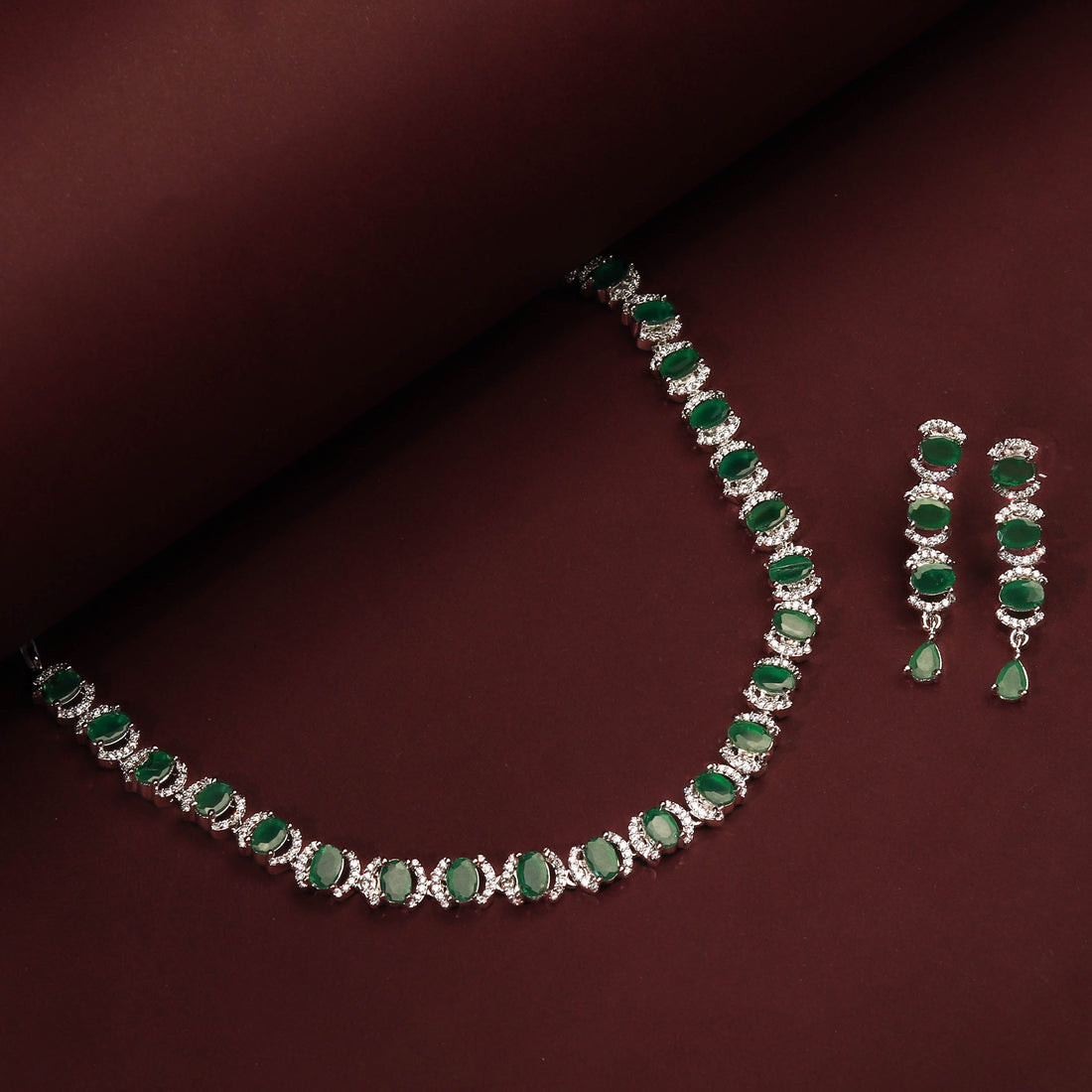 Rhodium Plated Beautiful Necklace Set With Emerald Green Stones And Pair Of Earrings