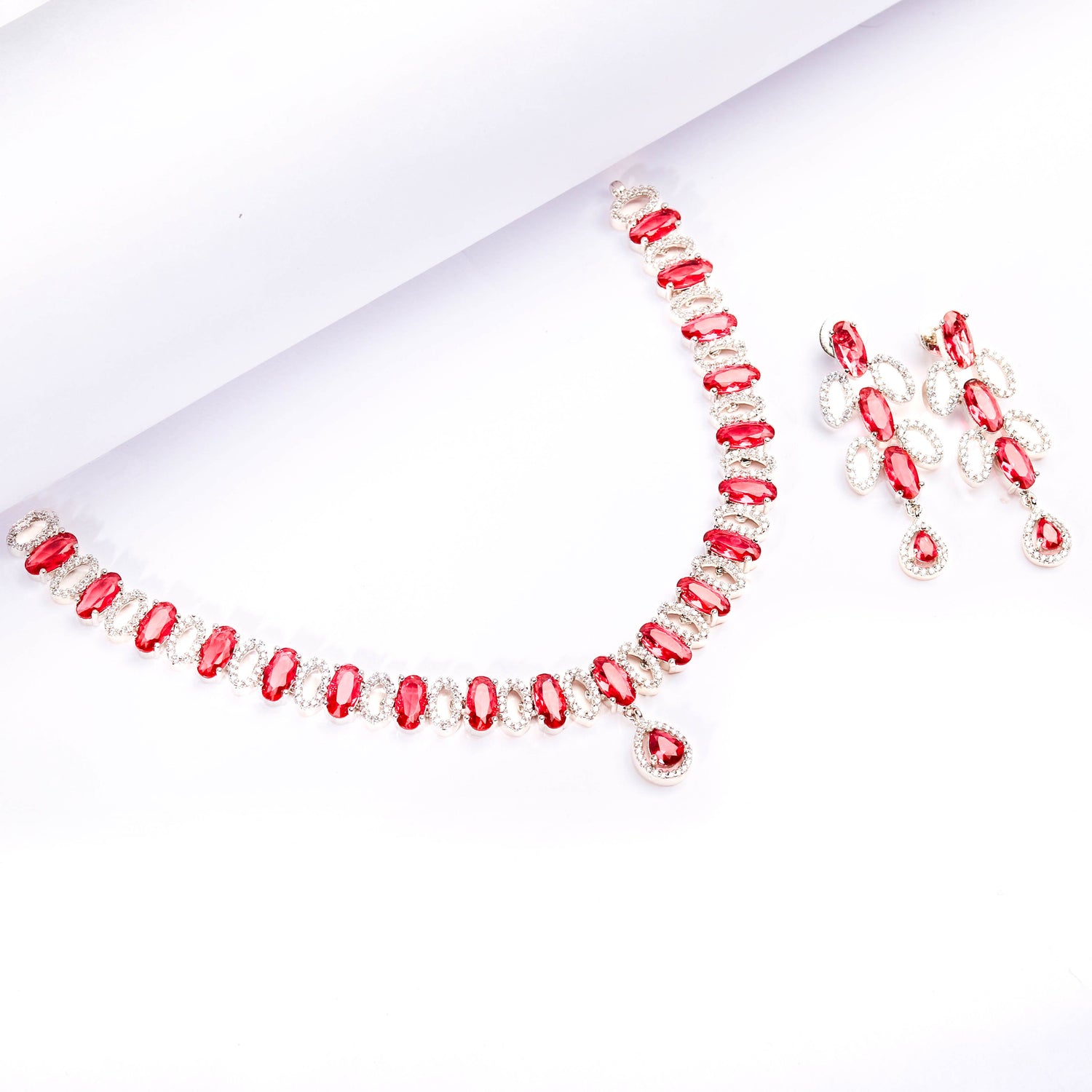 Rhodium Plated Elegant Necklace Set With Ruby Color Stones And Pair Of Earrings