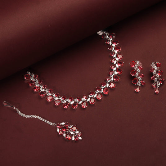 Rhodium Plated Luxurious Ruby Red Color Necklace Set With Earrings And Maang Tikka