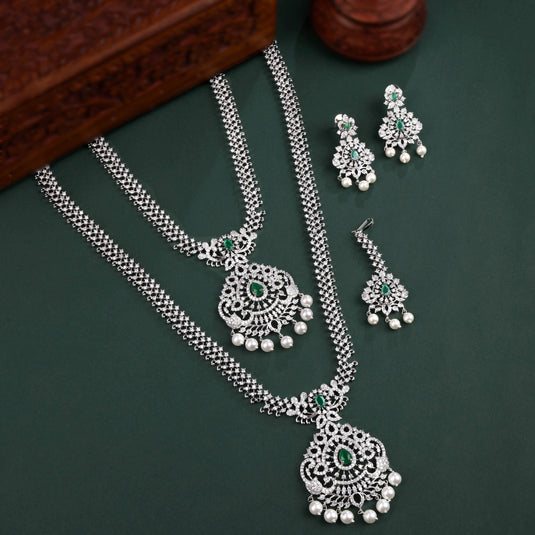 Rhodium Plated Necklace Set With Green Color Stones And Pearl Drops Style Work And Maang tikka